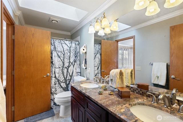 full bathroom featuring toilet, ornamental molding, a sink, and a skylight