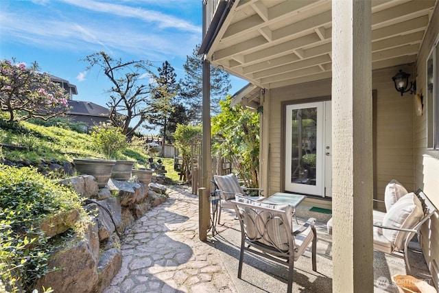 view of patio / terrace featuring fence