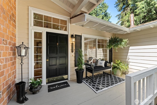 view of exterior entry featuring a porch