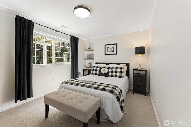 bedroom featuring carpet flooring, baseboards, and ornamental molding