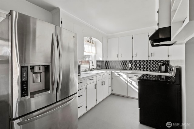 119 N Mckinley St, Burlington, WA 98233 - kitchen featuring a sink, under cabinet range hood, stainless steel appliances, light countertops, and white cabinetry