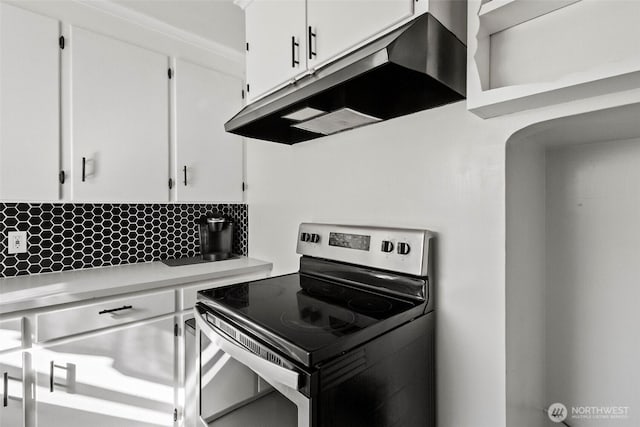 119 N Mckinley St, Burlington, WA 98233 - kitchen with white cabinets, stainless steel electric stove, backsplash, light countertops, and under cabinet range hood