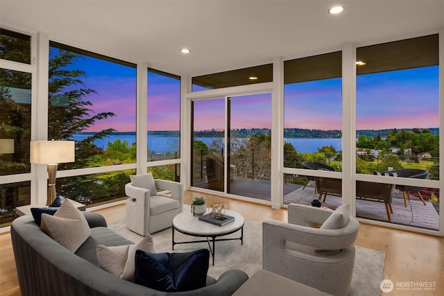 3812 Cascadia Ave S, Seattle, WA 98118 - sunroom / solarium featuring a water view, recessed lighting, expansive windows, and wood finished floors