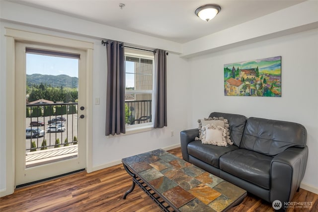 living room with wood finished floors and baseboards