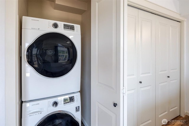 washroom with stacked washer / dryer