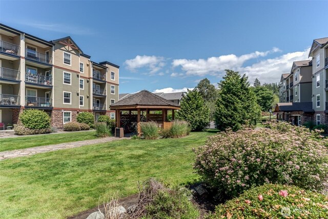 view of home's community featuring a gazebo and a yard