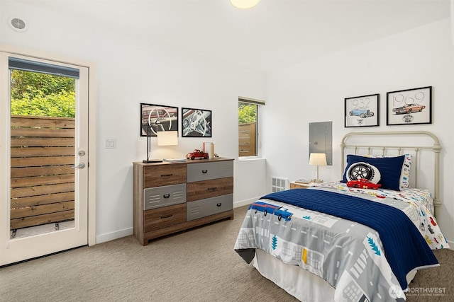 bedroom with carpet floors, multiple windows, and baseboards