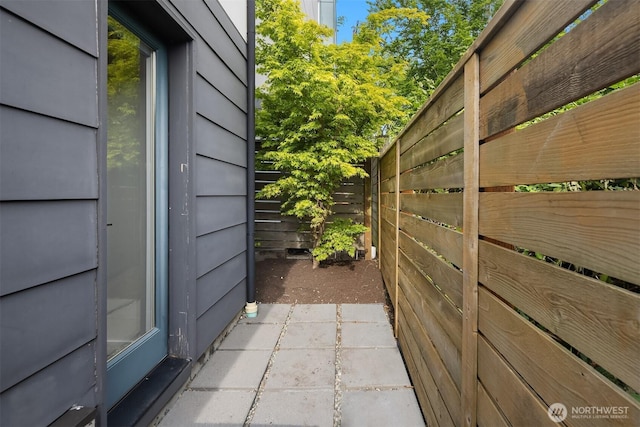 view of home's exterior featuring fence