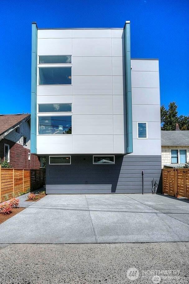 view of front of house featuring fence