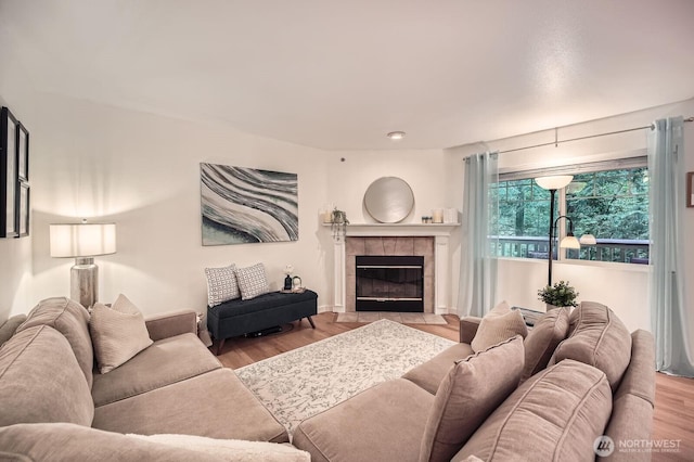 living area with wood finished floors and a fireplace