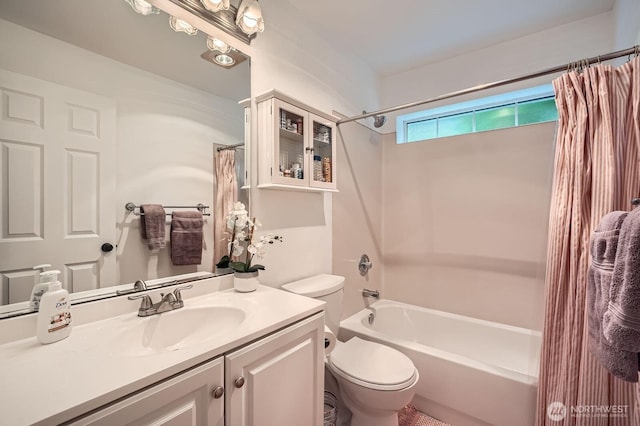 bathroom featuring vanity, toilet, and shower / tub combo
