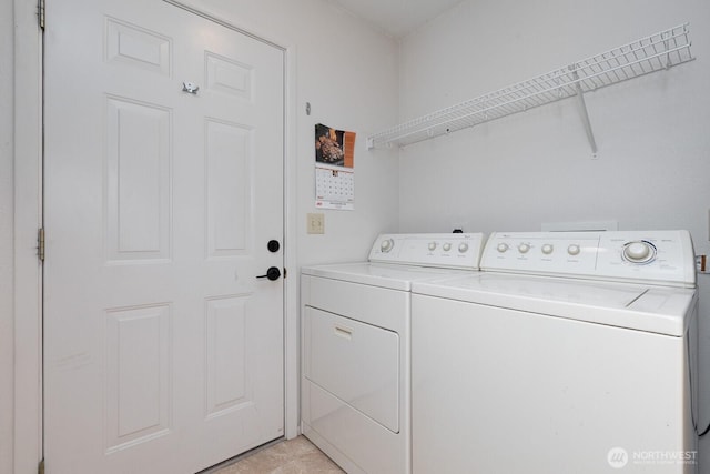 washroom with laundry area and washer and clothes dryer