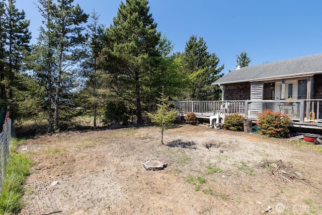 view of yard with a wooden deck