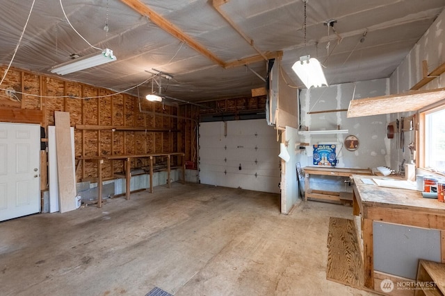 garage with a workshop area