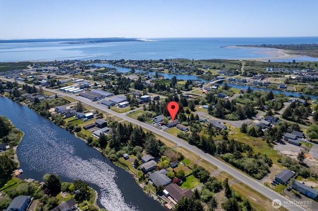 bird's eye view featuring a water view and a residential view