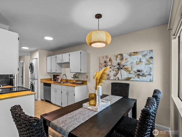 14148 74th Pl NE Unit 12C, Kirkland, WA 98034 - dining area with stacked washing maching and dryer and recessed lighting