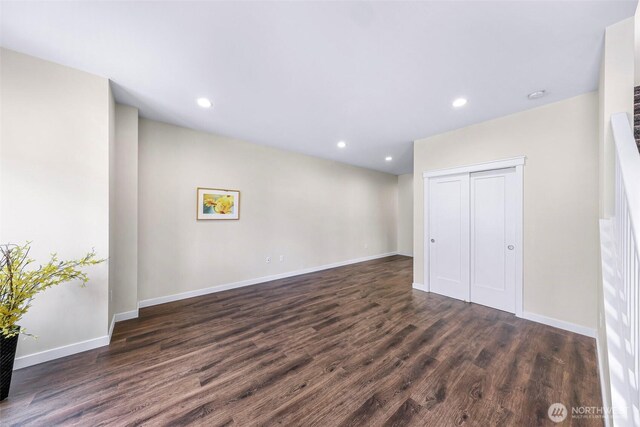 interior space with dark wood-style flooring, baseboards, and recessed lighting