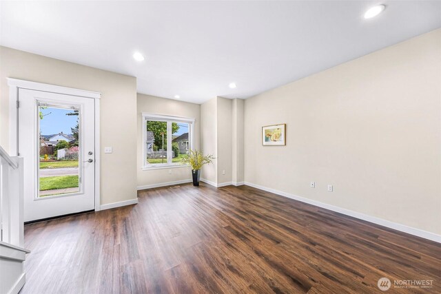 interior space with recessed lighting, baseboards, and dark wood finished floors