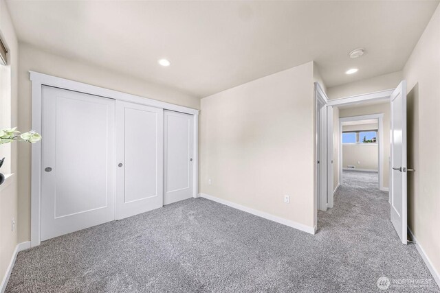 unfurnished bedroom with recessed lighting, carpet flooring, and baseboards