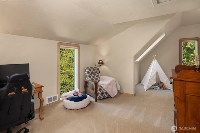 carpeted bedroom with baseboards, visible vents, and lofted ceiling