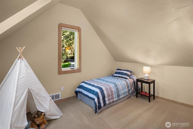 bedroom with visible vents, carpet flooring, baseboards, and vaulted ceiling