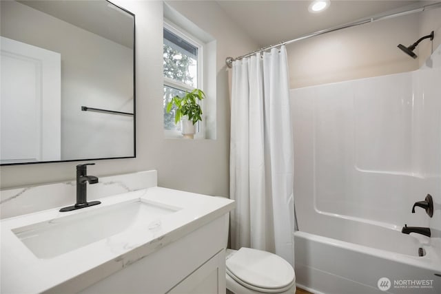 bathroom with shower / bath combo, toilet, vanity, and recessed lighting