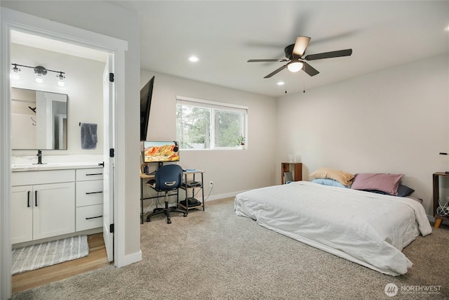 bedroom featuring light carpet, baseboards, recessed lighting, a ceiling fan, and connected bathroom