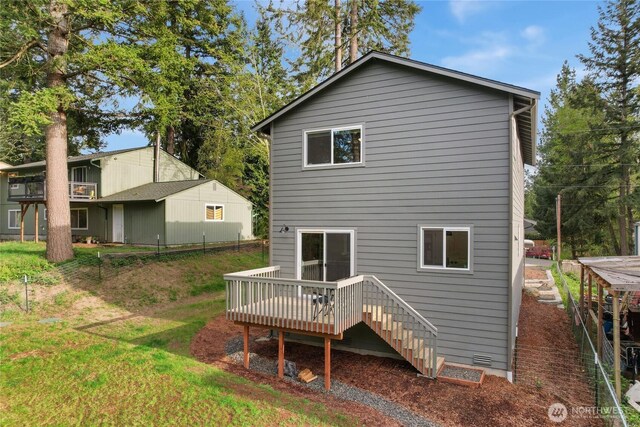 rear view of property with a deck