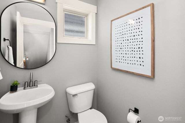 bathroom with a sink and toilet