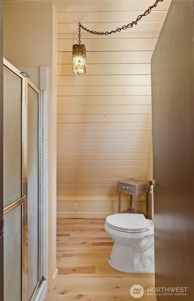 435 Lotloh St SE, Ocean Shores, WA 98569 - full bath with toilet, baseboards, wood finished floors, and a stall shower