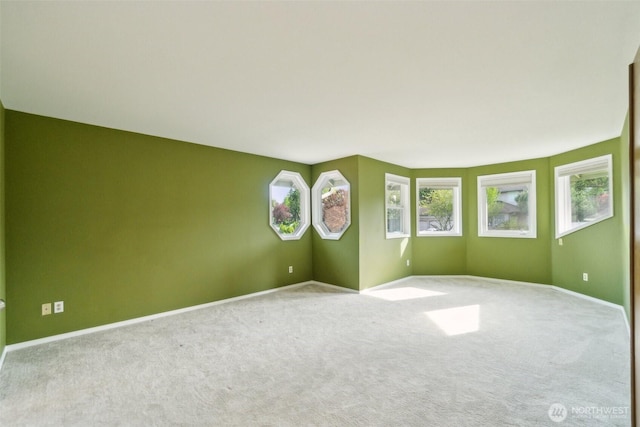 13233 W 44th Ave W, Mukilteo, WA 98275 - spare room featuring carpet flooring, plenty of natural light, and baseboards