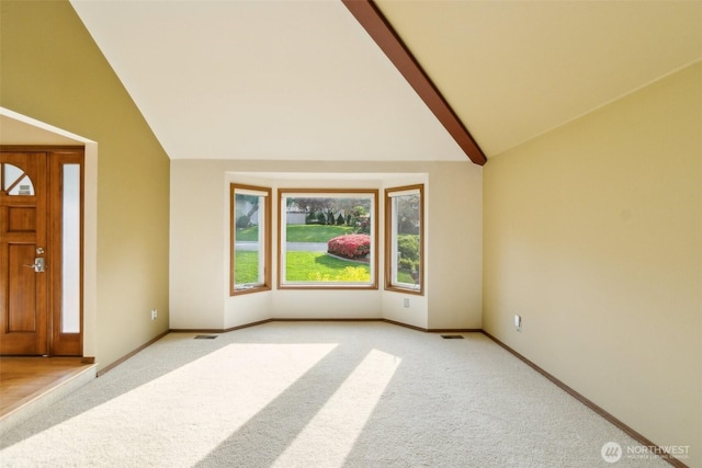 13233 W 44th Ave W, Mukilteo, WA 98275 - foyer entrance with light carpet, baseboards, beam ceiling, and high vaulted ceiling