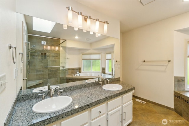 13233 W 44th Ave W, Mukilteo, WA 98275 - bathroom with a stall shower, tile patterned floors, a garden tub, baseboards, and double vanity