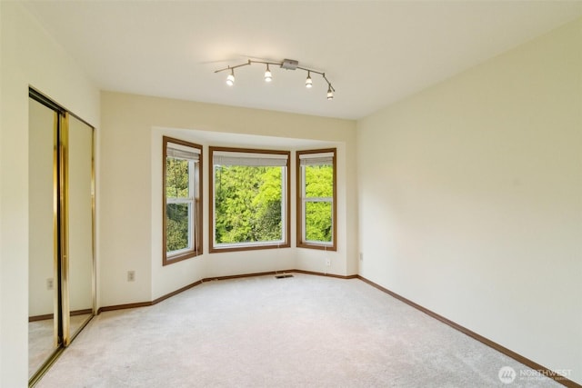 13233 W 44th Ave W, Mukilteo, WA 98275 - unfurnished bedroom featuring light colored carpet and baseboards