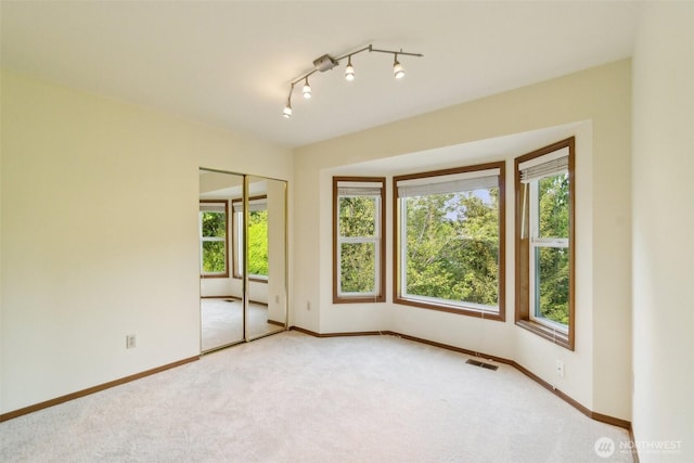 13233 W 44th Ave W, Mukilteo, WA 98275 - carpeted spare room featuring baseboards