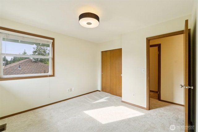 13233 W 44th Ave W, Mukilteo, WA 98275 - unfurnished bedroom with carpet flooring, baseboards, and a closet