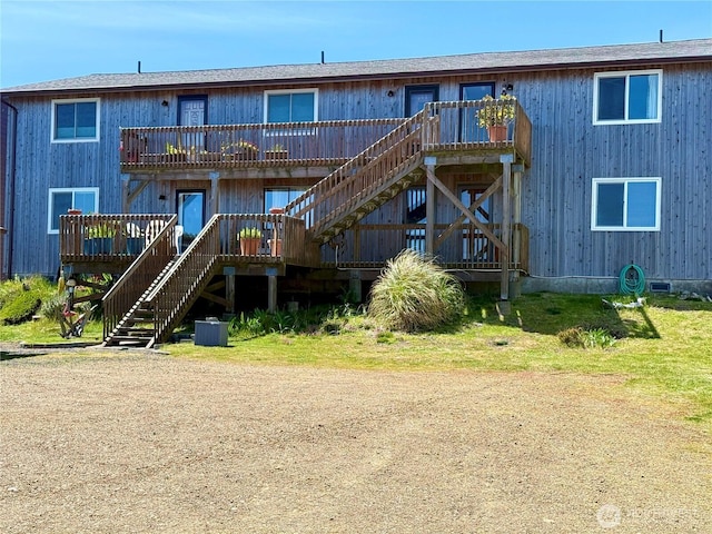 1311 Ocean Shores Blvd SW Unit 3, Ocean Shores, WA 98569 - back of property featuring stairway and a wooden deck