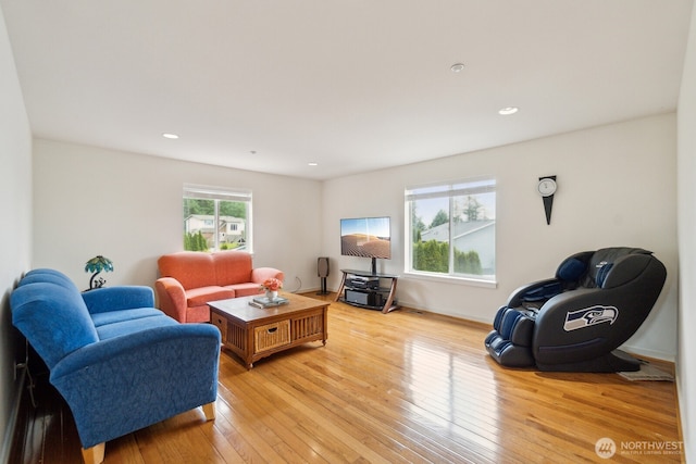 living area featuring recessed lighting and light wood-style flooring