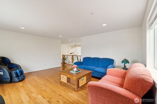 living room featuring light wood-style floors, baseboards, and recessed lighting