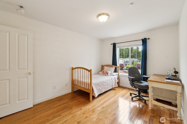 bedroom featuring visible vents and light wood-style flooring