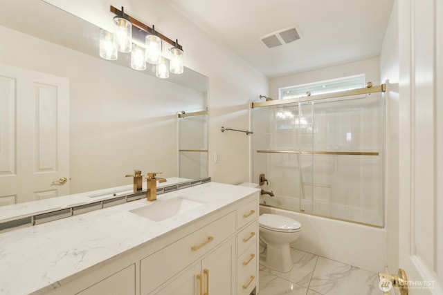 full bath featuring vanity, toilet, marble finish floor, combined bath / shower with glass door, and visible vents