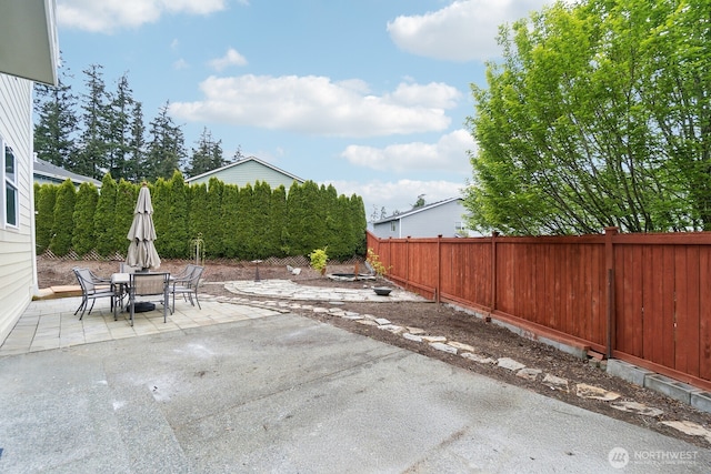 view of patio / terrace featuring a fenced backyard and outdoor dining space