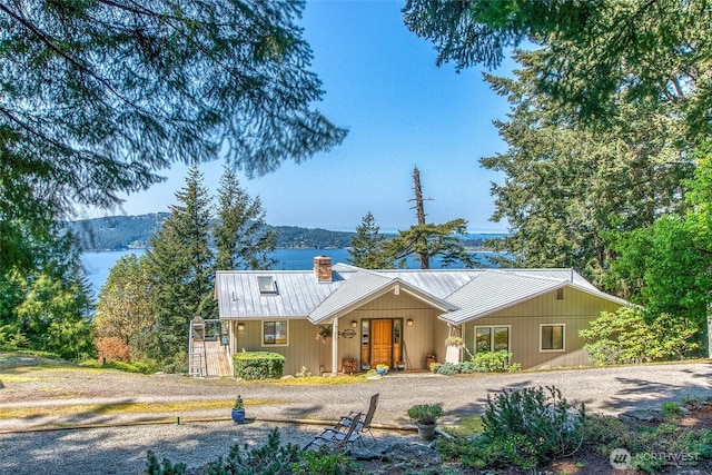 519 Highlands Dr, Orcas Island, WA 98245 - view of front of home featuring a chimney and metal roof