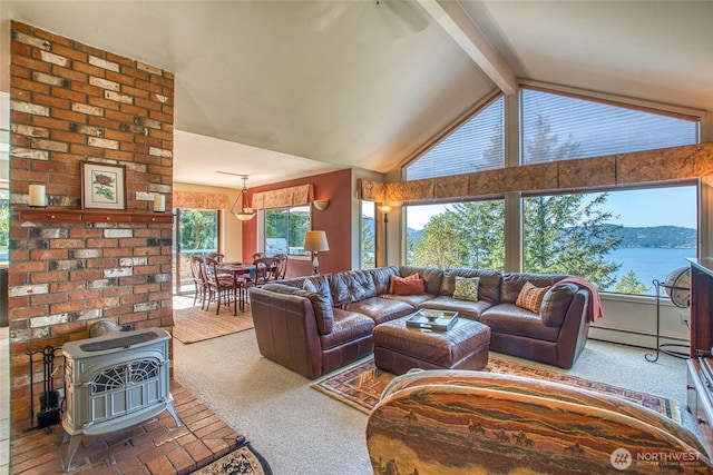 519 Highlands Dr, Orcas Island, WA 98245 - carpeted living area featuring a wood stove and a baseboard heating unit