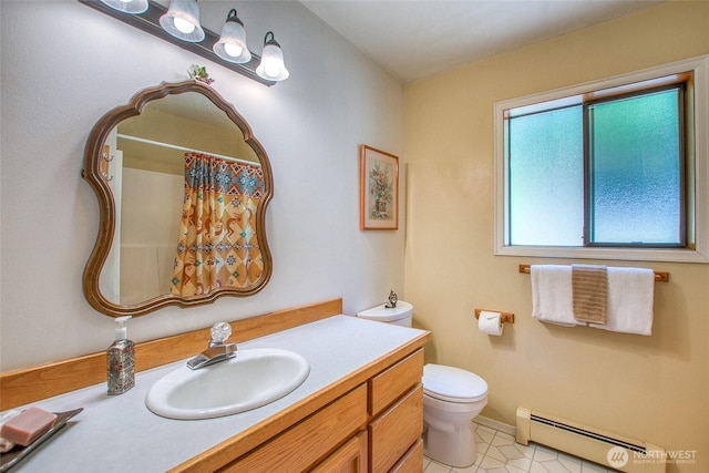 519 Highlands Dr, Orcas Island, WA 98245 - bathroom with a baseboard heating unit, vanity, toilet, a shower with shower curtain, and baseboards