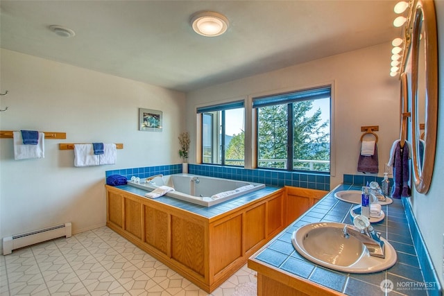 519 Highlands Dr, Orcas Island, WA 98245 - bathroom featuring baseboard heating, a bath, double vanity, and baseboards