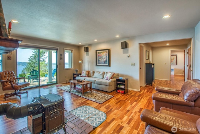 519 Highlands Dr, Orcas Island, WA 98245 - living room featuring light wood finished floors, recessed lighting, baseboards, and a textured ceiling