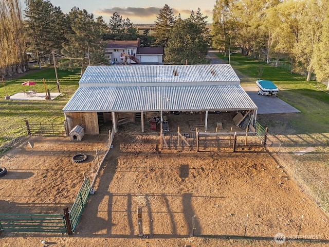 exterior space with an exterior structure, an outbuilding, and metal roof