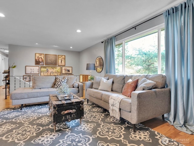 living area with wood finished floors and recessed lighting