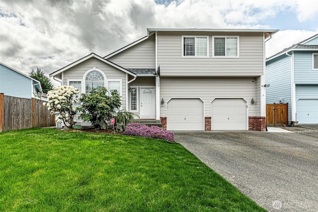 14231 SE 282nd St, Kent, WA 98042 - view of front of house featuring aphalt driveway, fence, a front lawn, brick siding, and a garage